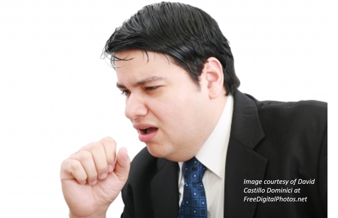 A picture of a businessman coughing