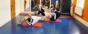 Working the stomach muscles in an HIIT class