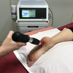 Someone being treated using extracorporeal shockwave treatment Central Health Physiotherapy